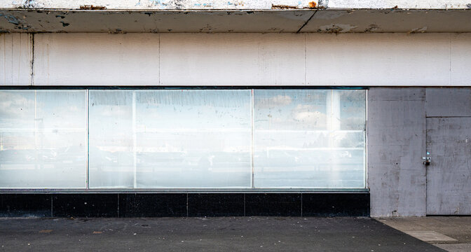 Closed and empty shops in a shopping centre depicting the dying UK high street.