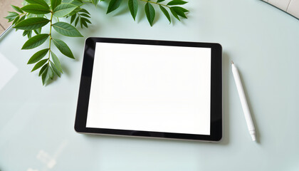 Modern tablet on glass table surrounded by green leaves promoting technology, minimalism, and creativity in a stylish workspace environment