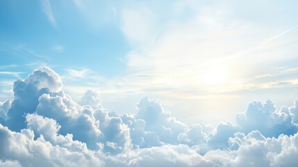 Fototapeta premium A serene sky filled with soft clouds and a bright sun illuminating the atmosphere, creating a tranquil and uplifting scene.