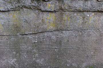 Background of destroyed concrete path, gray concrete, concrete texture, close-up. Natural photo. Old concrete slab