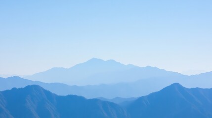 Naklejka premium Several blue mountains and a bright sky during daylight hours