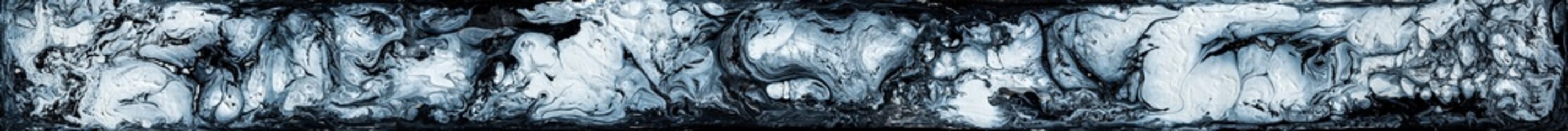 Beautiful black and white marble texture. Abstract background of flowing black and white paint with spots. Space background of acrylic paint with stars and beautiful nebulae. Large size photo.