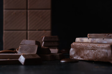 Close-up of chocolate bars and chunks, perfect for gourmet or confectionery-themed visuals.