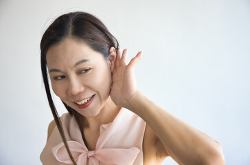 Happy South Asian Indian woman hearing or listening with happy smiling positive mood, feeling good