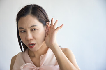 Southeast Asian Woman's Hearing Ear Captures the Essence of News, Fake or Real News, Hard of...