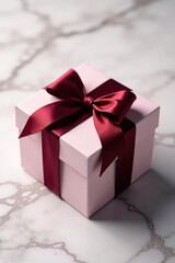 Gift box with burgundy bow on a marble background, paper box, luxurious ambiance, elegant packaging