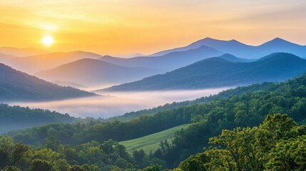 Obraz premium A vast mountain range under golden sunrise light, mist rolling through valleys, epic natural beauty, adventure, peace