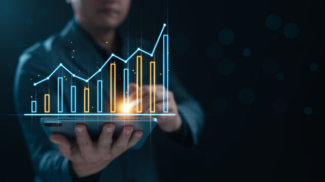 Businessman using tablet to show graphs and charts of business and company growth, business development leading to success, financial data analysis, statistical reports, planning and accounting.