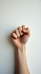 Naklejka premium Accelerate action. Stay strong. Hand is raised in the air with the fingers spread out. Concept of power and strength, as if the person is making a fist to show their determination or resolve