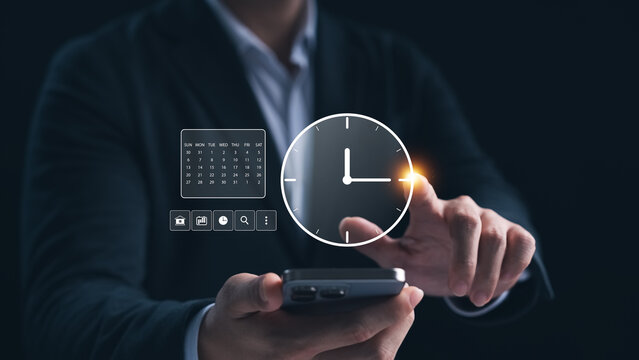 Professional time management, businessman Touching virtual clock and calendar to plan work to improve work efficiency, saving work time to reduce cost.