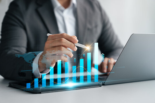 Businessman analyze business growth chart and economic growth for financial and business investment decision, planning strategy, data collection, development to achieve future goals.