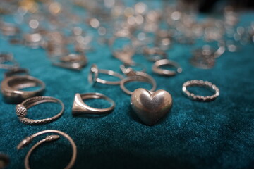 Silver rings of different shapes. Craft fair.