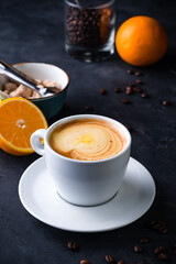 cappuccino coffee with orange juice in a cup
