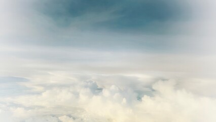 Majestic cloudscape with golden light and layered clouds stretching into the vast sky