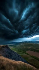 Gardinen Dramatic storm clouds gather over a verdant landscape at dusk, creating a powerful natural spectacle and a sense of impending rain © LEO_ The Guru