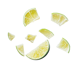 Sliced lime pieces floating in mid-air create a refreshing and vibrant culinary theme for summer dishes and cocktails, cut out