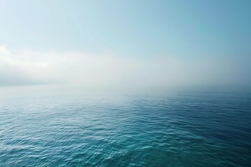 Obraz premium a scene of calm sea during a foggy morning