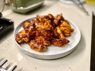 Air Fryer Chicken whole wings in plate ready to serve