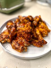 Air Fryer Chicken whole wings in plate ready to serve