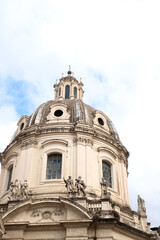 Obraz premium Dome of white travertine marble church of the most holy name of Mary at the Trajan Forum in Rome, Italy