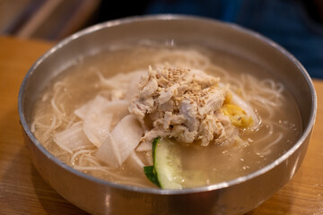 Chogye Tang or Korean cold chicken noodle soup served in a bowl