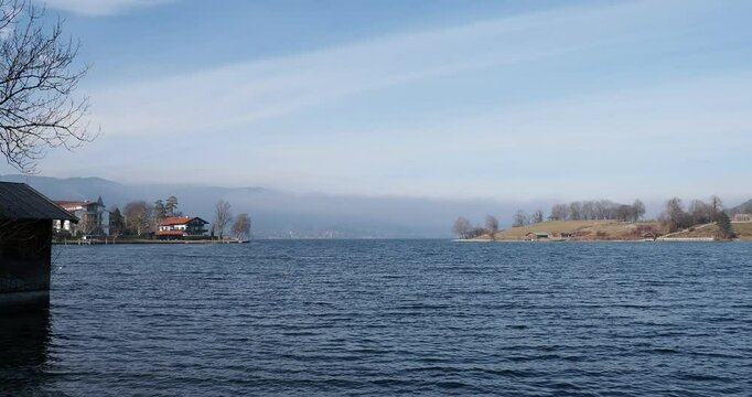 Lake Tegernsee in the Bavarian Alps, seen from Rottach Bay and the lake promenade south of the village of Rottach-Egern