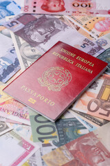 International passport of a citizen of Italy on background of paper banknotes
