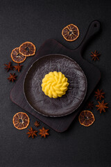 Round sweet tart of yellow color with citrus and passion fruit flavor