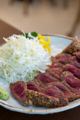 Set of Gyukatsu or beef cutlet served with cabbage. A traditional Japanese food that consists of a deep-fried beef cutlet.