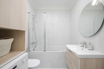 Toilet bowl, sink and bathtub in the bathroom