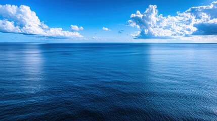 Fototapeta premium Vast Ocean Panorama: Serenity under a Blue Sky