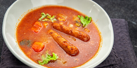 Tomato soup with sausages fresh tasty food dish delicious gourmet food background on the table rustic food top view copy space