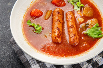 Tomato soup with sausages fresh tasty food dish delicious gourmet food background on the table rustic food top view copy space