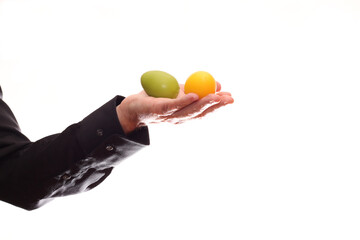 Painted eggs in the hand of a priest on Easter.
