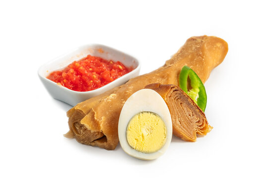 Classic Yemenite Jachnun. A classic Jewish Yemenite meal of Jachnun, grated tomato, boiled egg and hot pepper. Usually served for breakfast or lunch on Shabbat (Saturday)
