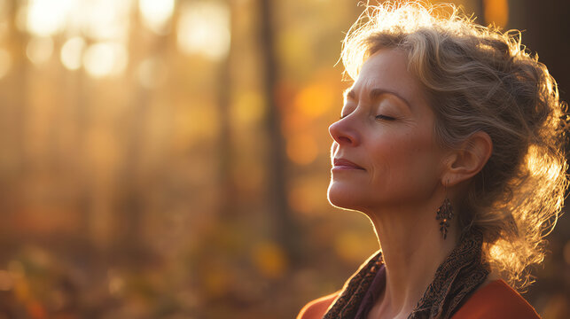 Serene woman practicing gratitude in the woods, warm golden sunlight illuminating her face, deep breathing, and spiritual connection to nature