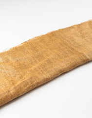 folded jute hessian gunny sack canvas coarse texture brown burlack white diagonal background