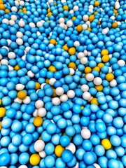 Looking Down at Blue White and Yellow Balls in Bulk