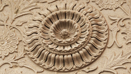 Decorated carving design on the wall of an ancient building