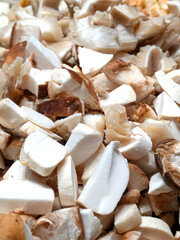 Close up of raw sliced and chopped mixed mushrooms fungi