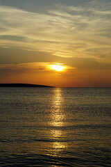 Shiny pastel colors sunset above sea surface during summer