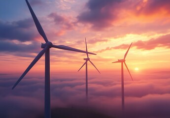 Fototapeta premium Breathtaking view of towering wind turbines emerging from a sea of clouds at sunrise