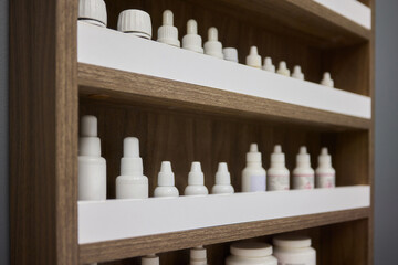 Fototapeta premium An Elegant and Stylish Shelf that Beautifully Displays a Variety of Bottles and Unique Containers