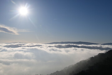 Obraz premium beautiful sunrise in the mountains over the fog and clouds