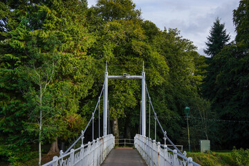 Fototapeta premium Ness Bank footbridge over the river Ness and Ness Islands in Inverness