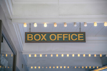 Box Office on a wooden signage hanging on a ceiling with small light bulbs in a row at Austin, TX