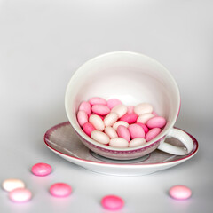 pink and white candy in a cup