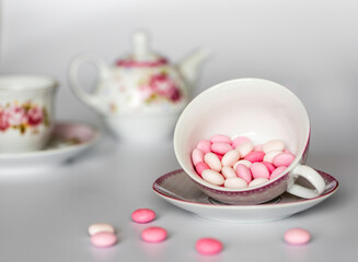 pink and white candy in a cup