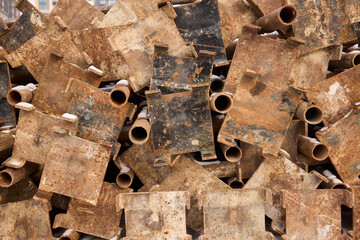Rusty metal blocks piled together create an appealing industrial aesthetic that captures attention