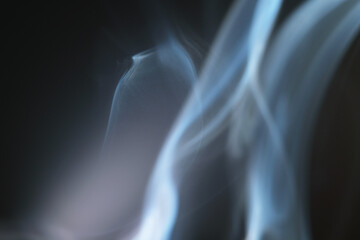 Obraz premium Macro shot of smoke swirl in the air as background